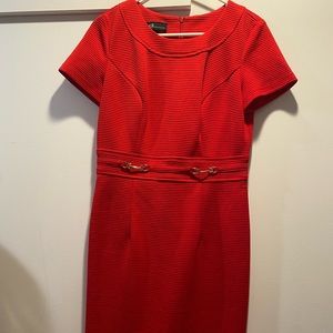 Beautiful red dress with short sleeves and gold accents.